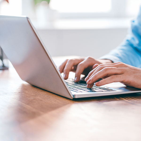 Person using laptop at desk