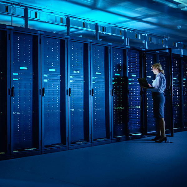 Woman in data center with servers