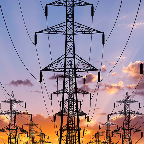 Utility power lines at sunset