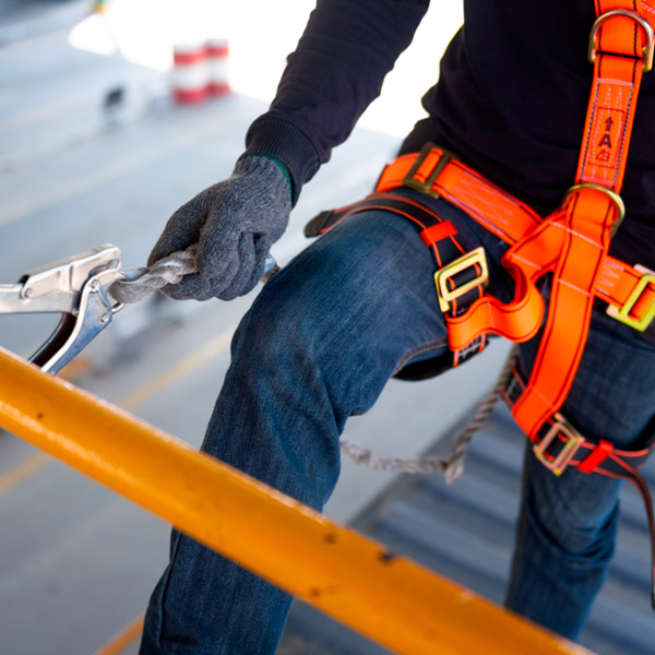 Construction worker using fall protection.
