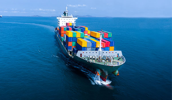 Supply chain boat in ocean with cargo