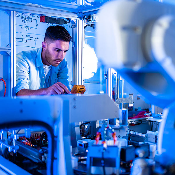 Male technician working in automation lab