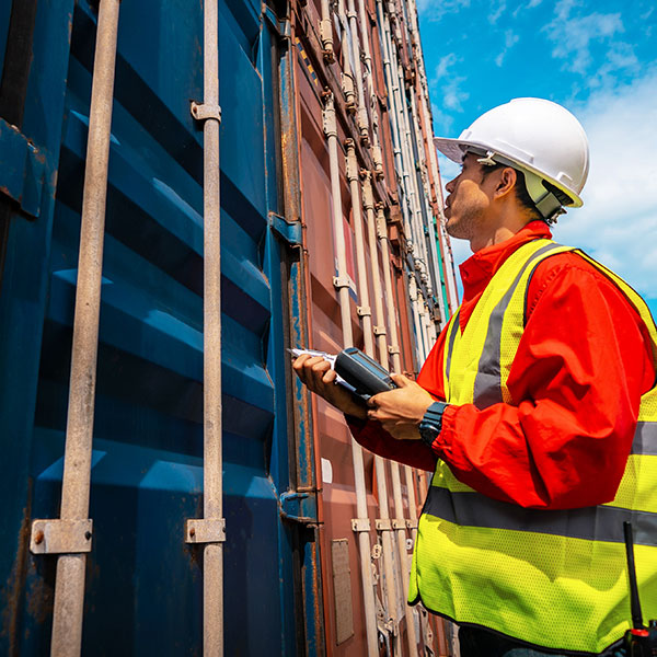 Man inspecting storage containers