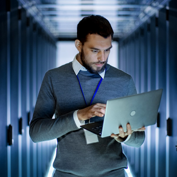 Security expert working in data center.