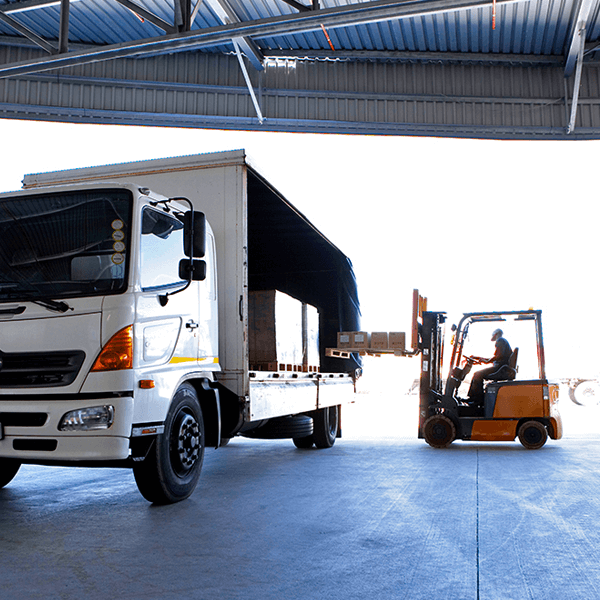 Truck being loaded with boxes on forklift