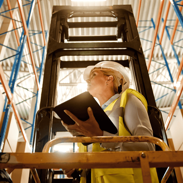 Woman in supply warehouse with tablet