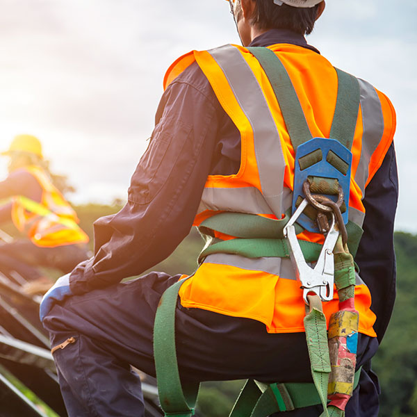 Worker with fall protection gear