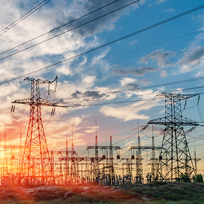 Electric substation power lines at sunset