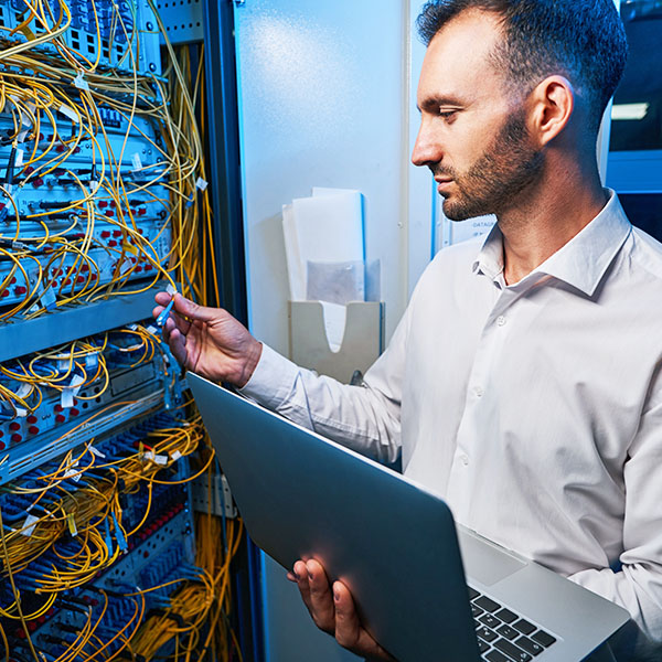 Technician inspecting fiber cabling