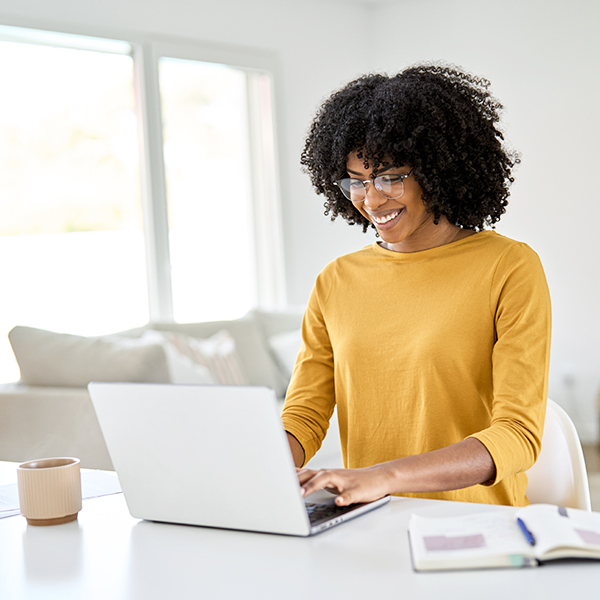 Woman using laptop at home