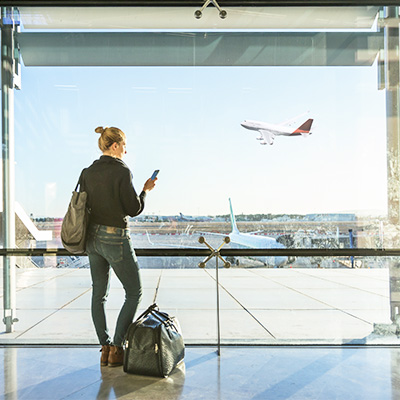 Person holding phone at airport