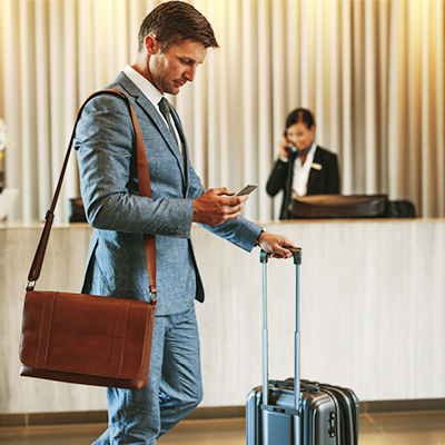 Man on cellphone in hotel lobby