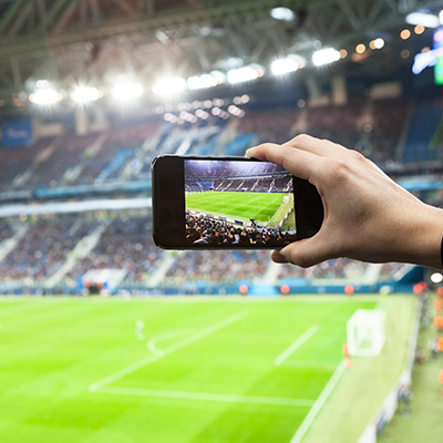 Phone taking photo of large stadium