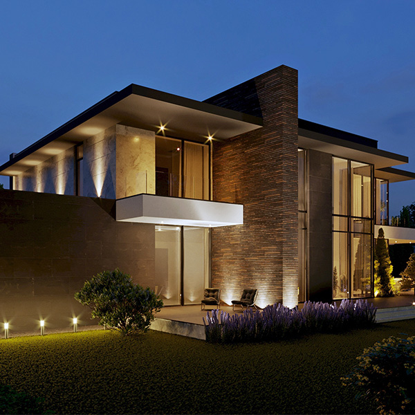 Modern home with bright exterior lighting