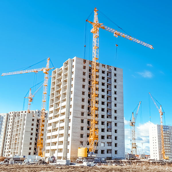 Cranes at commercial construction site