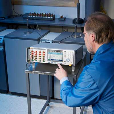 Fluke Technician operating electronic measurement device Solutions