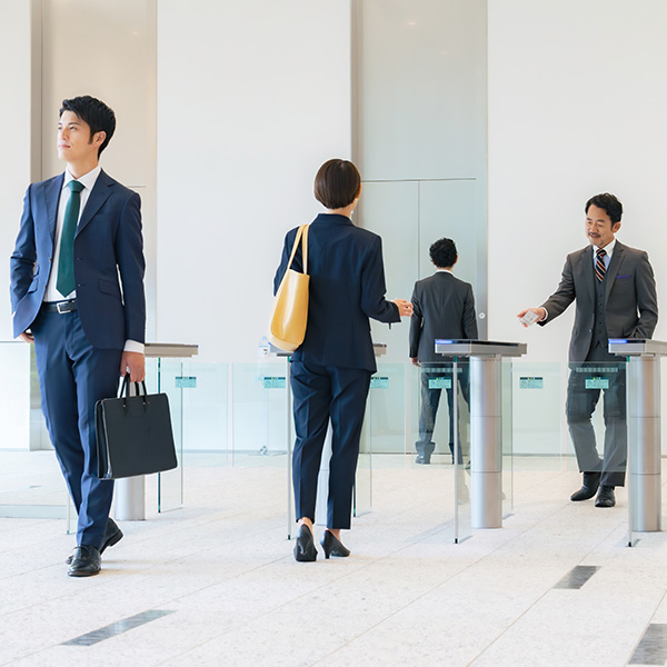 Business people scanning into building