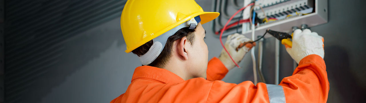 Electrician working on electrical switches