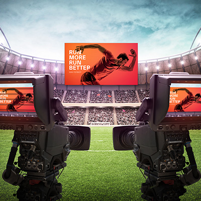 Large advertisement on screen at sports venue