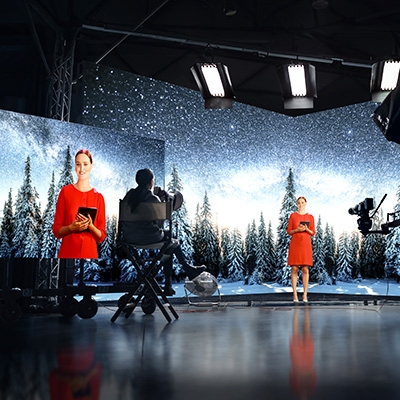 Television shoot with large screen showing a preview