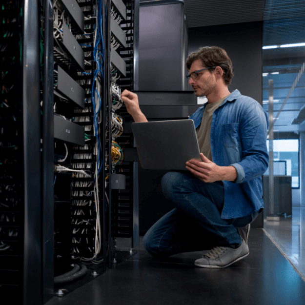 Data center operator servicing server rack