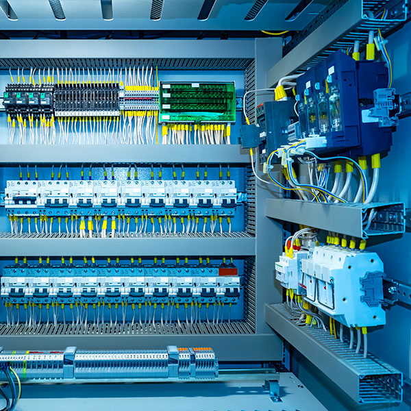 Enclosure with wire switchboard panels for automation.