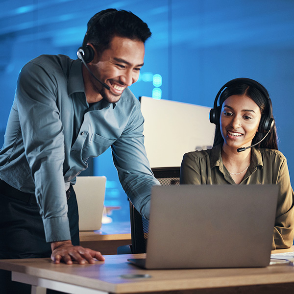 IT manager with headset collaborating