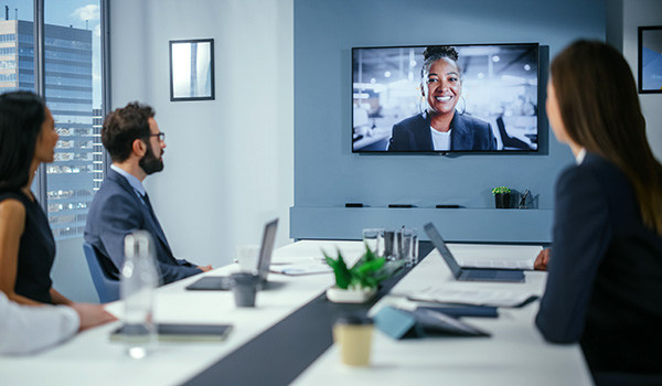 Professional AV conference room with digital meeting.