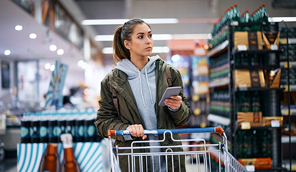 Customer in retail store using mobile phone wireless network.