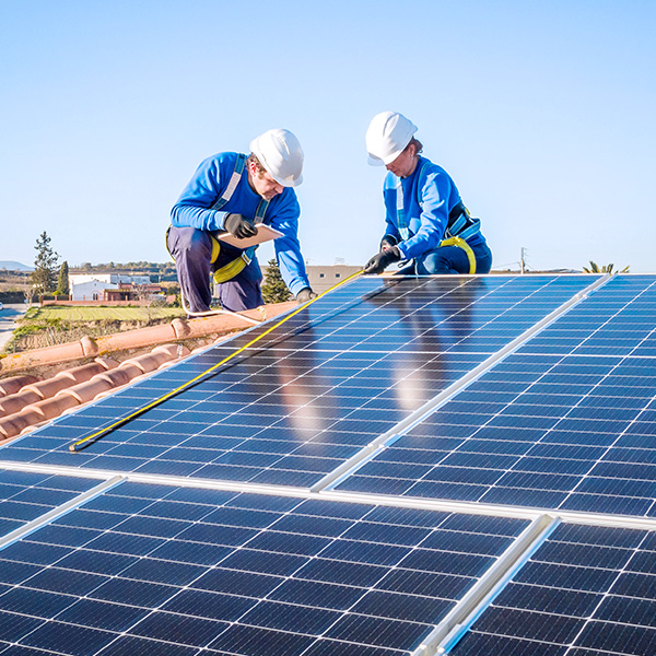 Workers installing residential solar panels