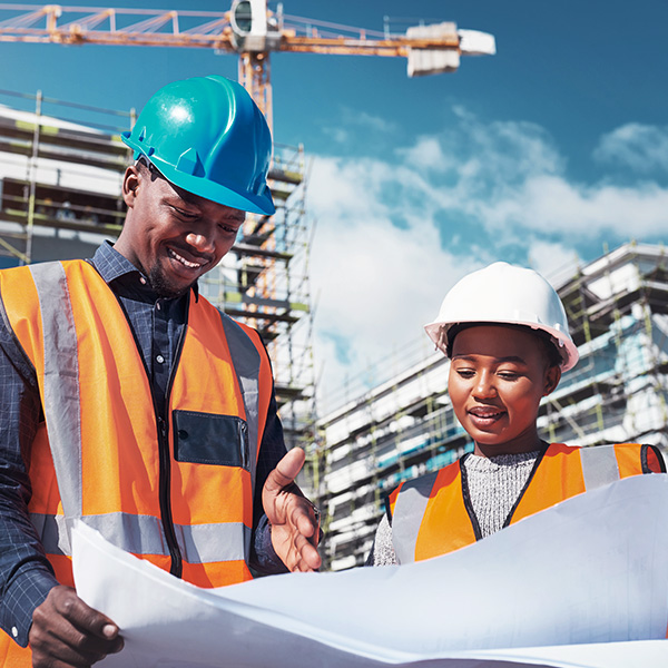 Construction project managers viewing blueprints