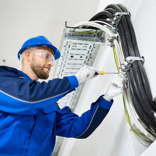 Engineer installing cabling