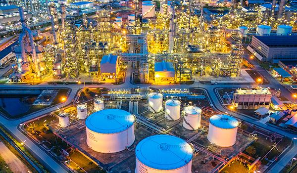 Bright chemical refinery at night