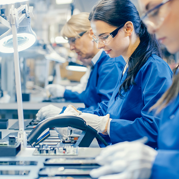 Assembly workers in factory line