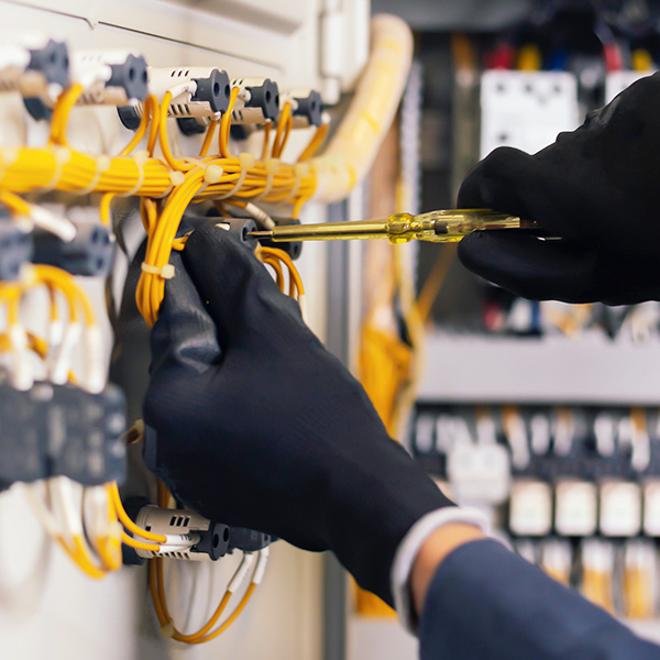Person installing electrical wiring