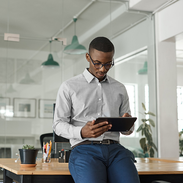 Professional using wireless device in modern office.