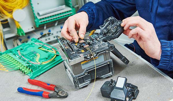 Fiber optic cable splice machine in work.