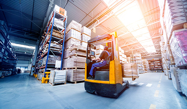 Forklift loader in storage warehouse ship yard.