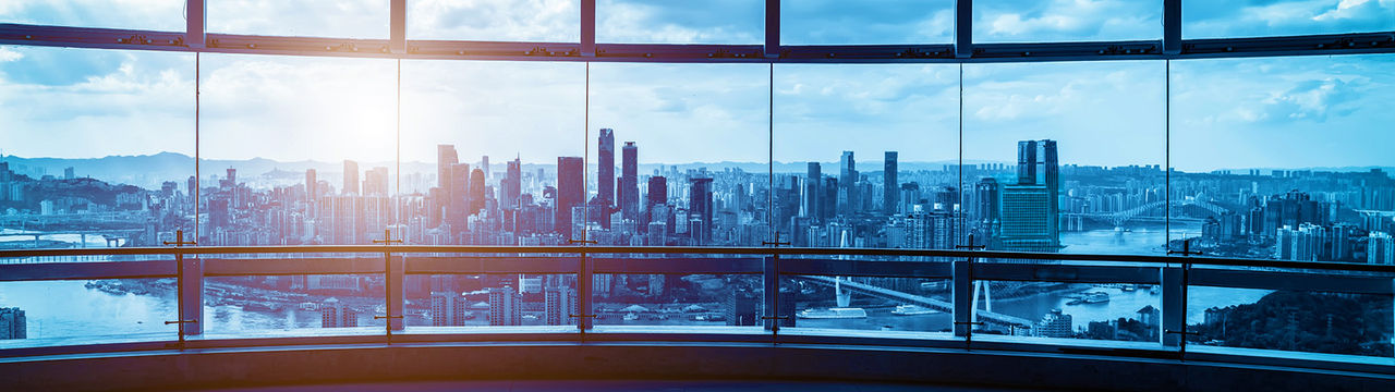 Office building glass and city skyline