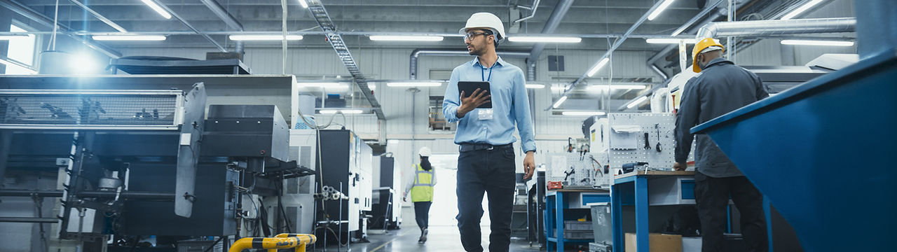 Engineer monitoring automation factory.