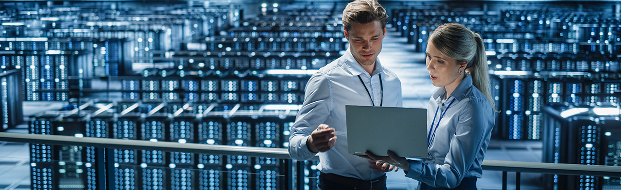 Workers with laptop in hyper scale data center