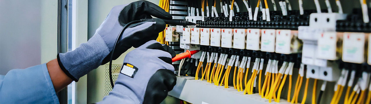 Electrical engineer measures with multimeter