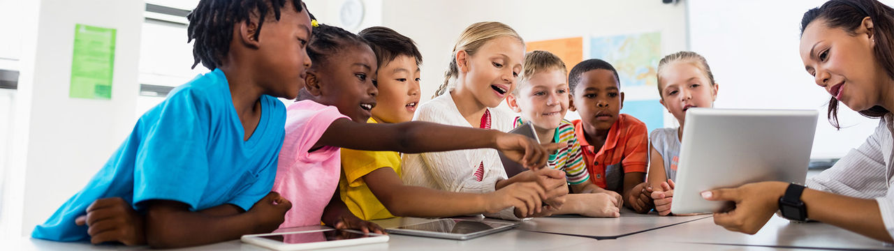 Children in classroom with learning technology