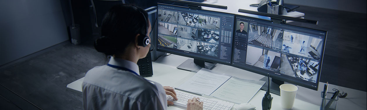 Security officer working in security control room.