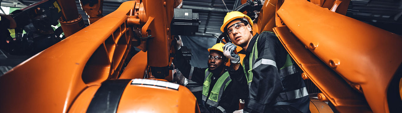 Engineers working on automation machinery