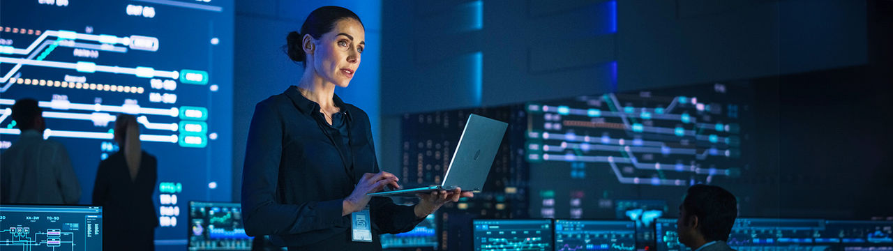 Woman with laptop in security center