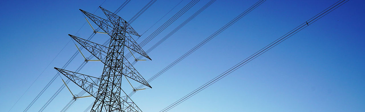 High voltage electricity cables with blue sky