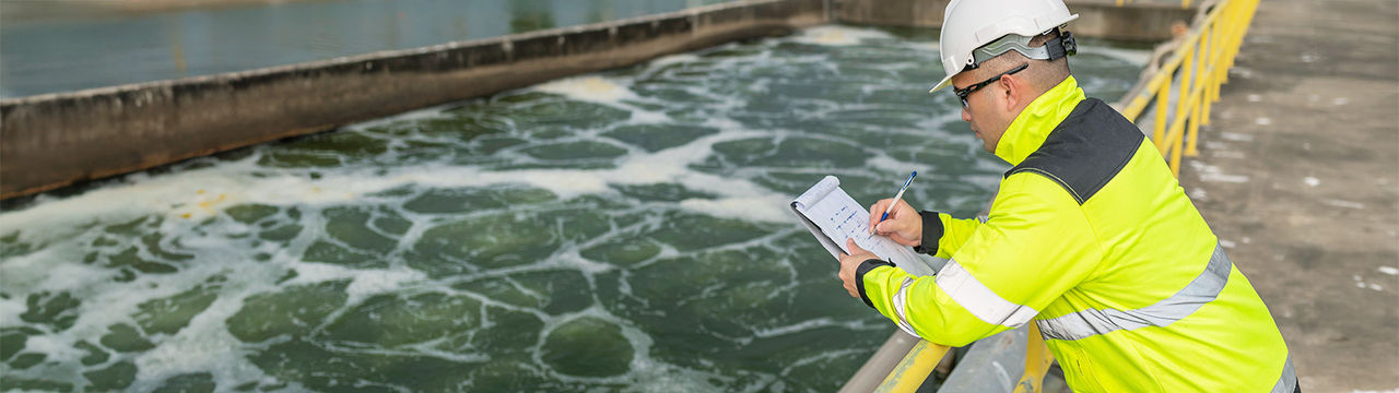 Engineer working at wastewater treatment plant