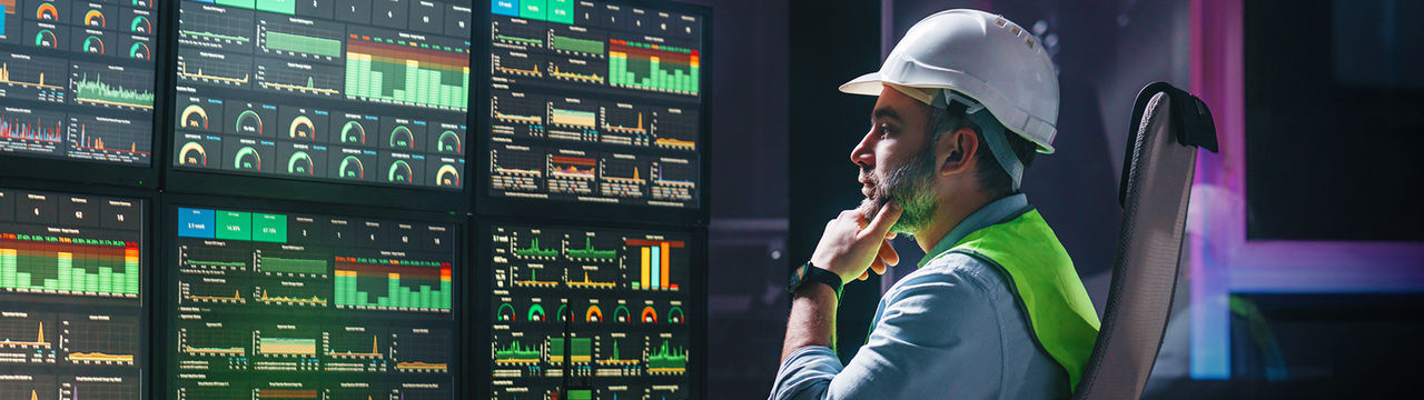 Engineer monitoring utilities on screen