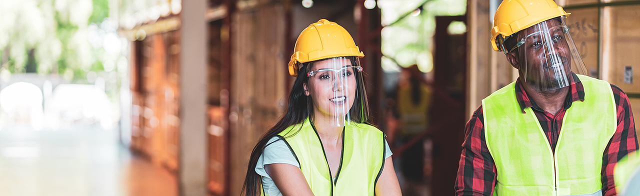 Workers wearing face shields
